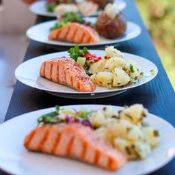 Plates of salmon and potatoes, waiting to be served at the restaurant at Seili.